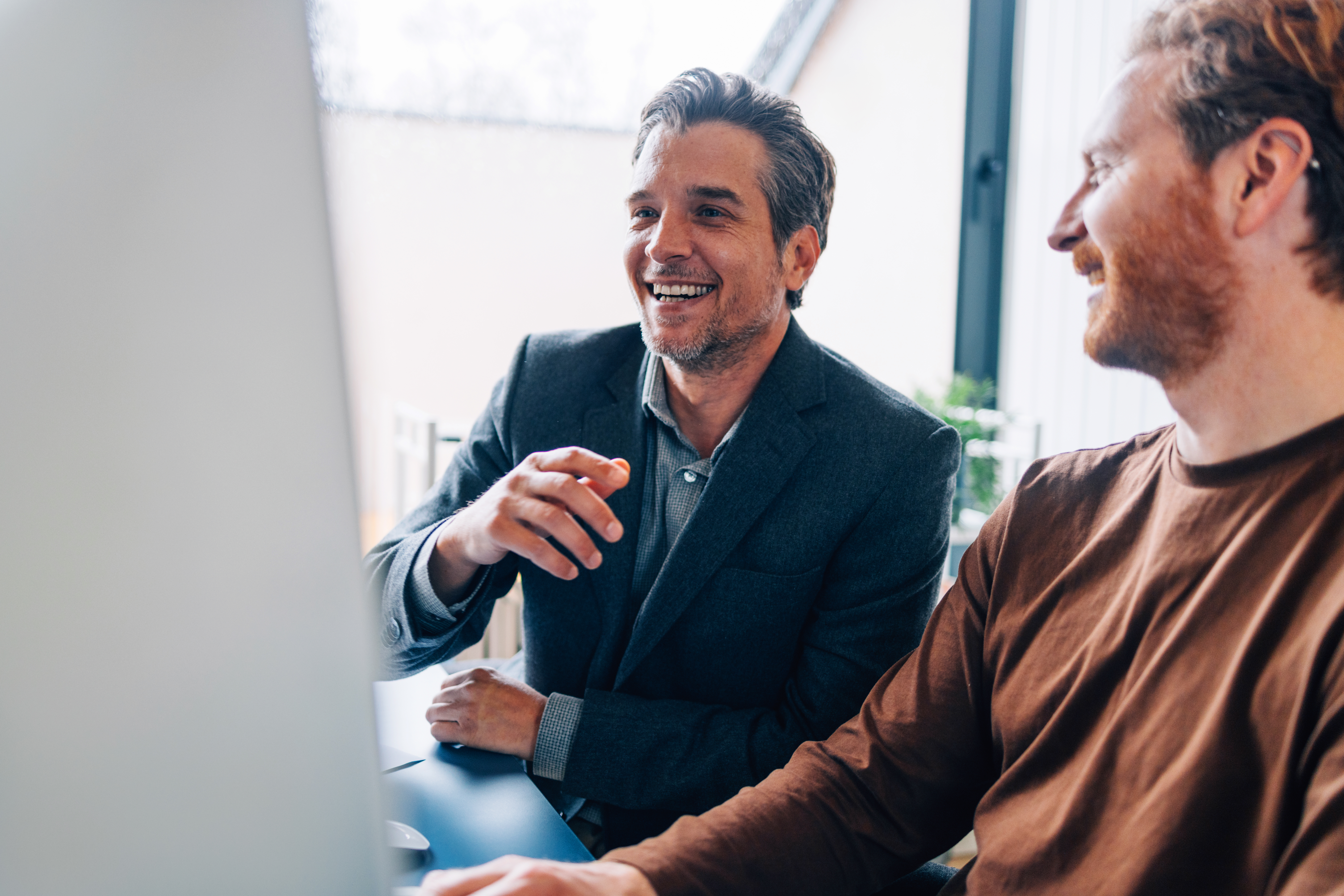 Man talking with colleagues 